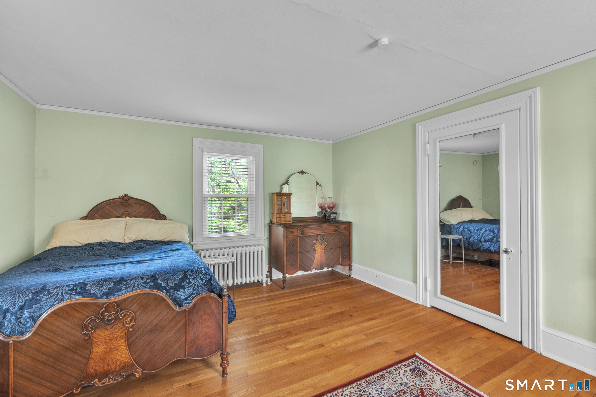 808 Branch Road Suffield, CT 06078 - Photo 24 of 40 a bedroom with a bed and a window