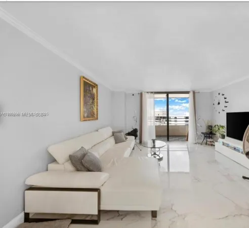 a living room with furniture and flat screen tv