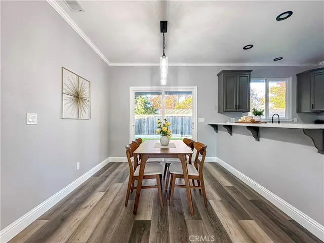 a backyard of a house with grass and plants