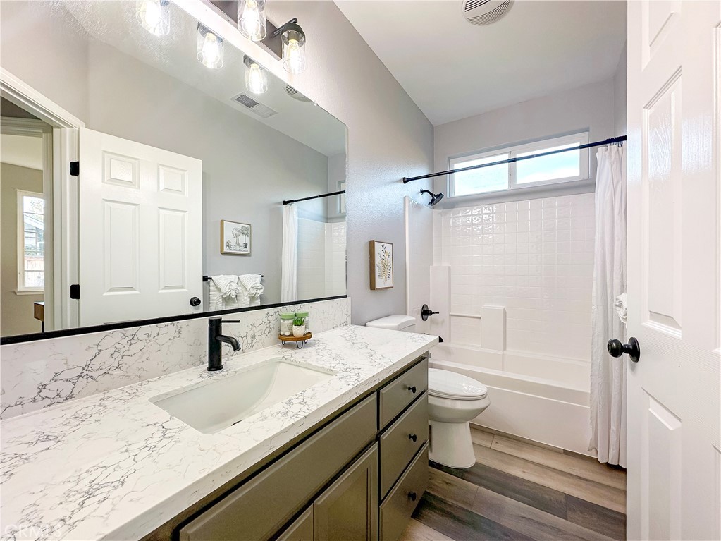 16 Tierra Rosa Lane Chico, CA 95973 - Photo 20 of 43 a bathroom with a granite countertop sink a toilet and shower