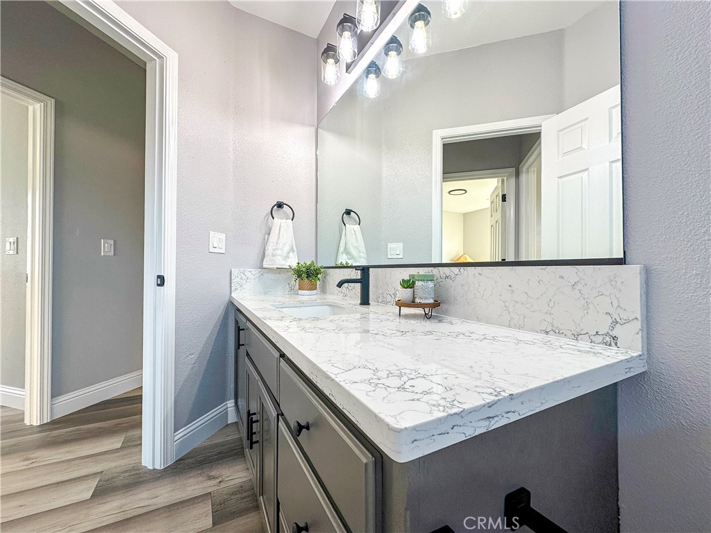 16 Tierra Rosa Lane Chico, CA 95973 - Photo 22 of 43 a bathroom with a granite countertop sink a large mirror and vanity
