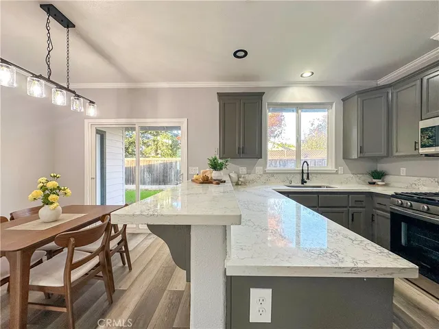 a bathroom with a granite countertop sink a large mirror and vanity