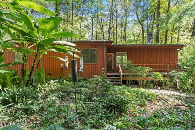 front view of a house with a tree