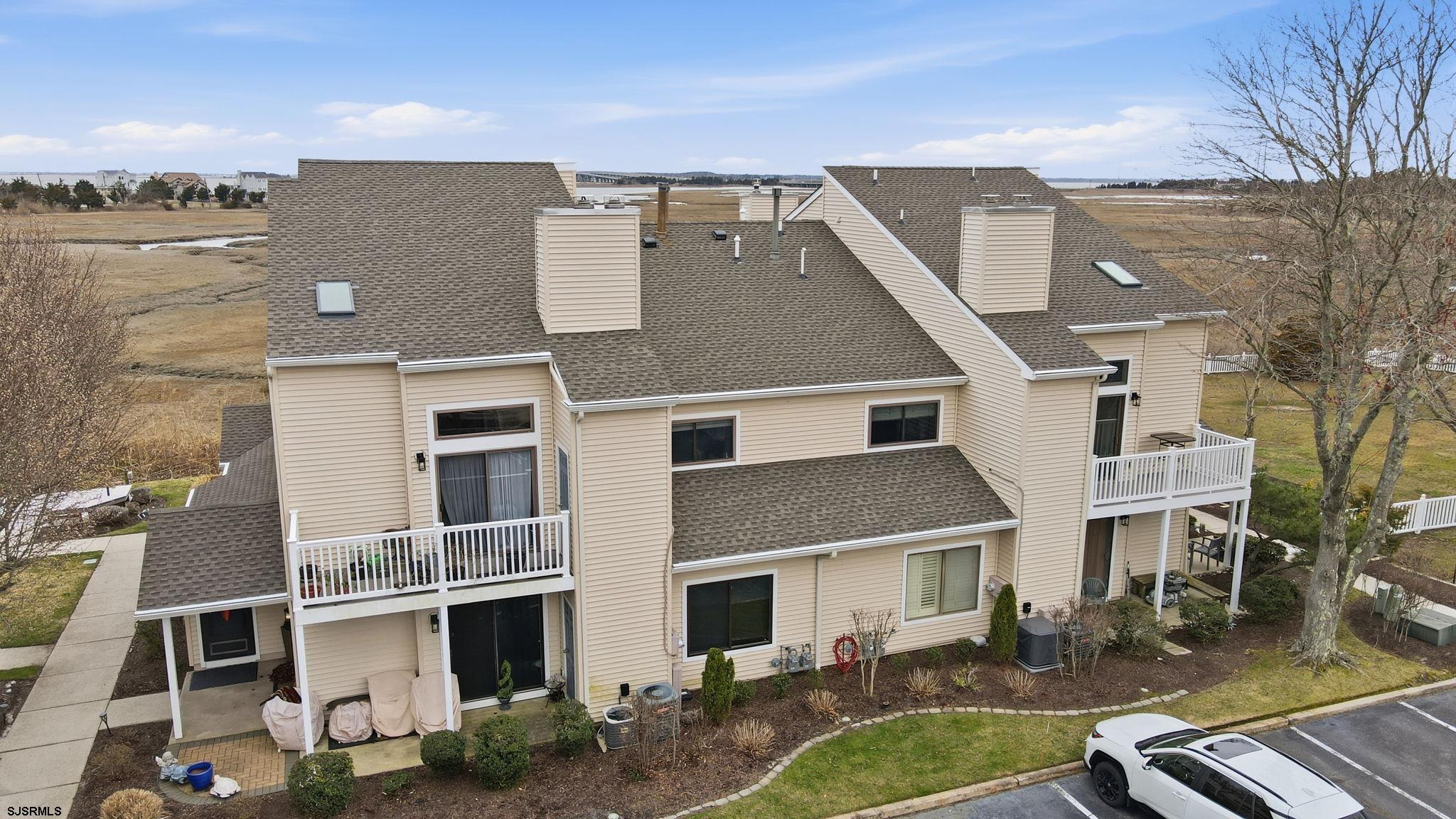 598 Mays Landing Road, Unit 202 Somers Point, NJ 08244 - Photo 2 of 23 a front view of a house with garden