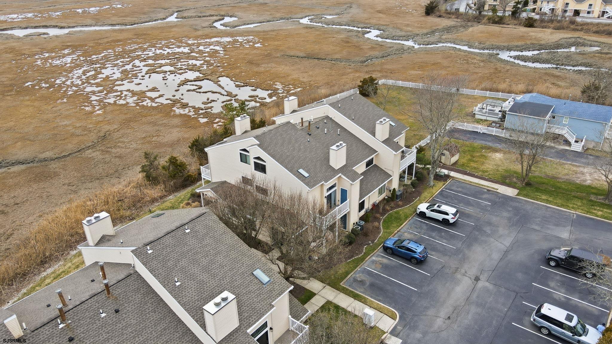 598 Mays Landing Road, Unit 202 Somers Point, NJ 08244 - Photo 21 of 23 an aerial view of residential houses with outdoor space