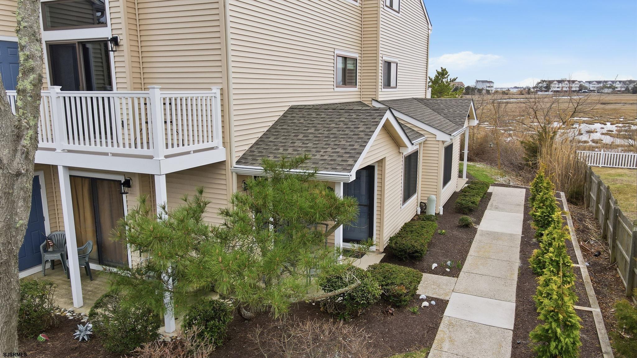 598 Mays Landing Road, Unit 202 Somers Point, NJ 08244 - Photo 4 of 23 a view of a house with a yard