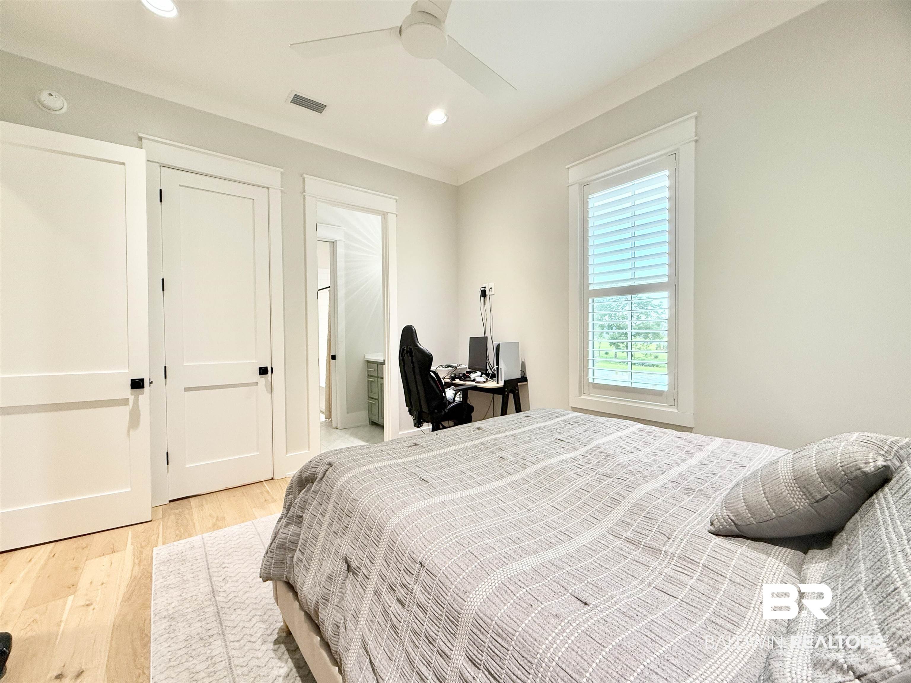 21767 Gallery Boulevard Fairhope, AL 36532 - Photo 47 of 74 Bedroom featuring light wood-style flooring, recessed lighting, ceiling fan, and connected bathroom