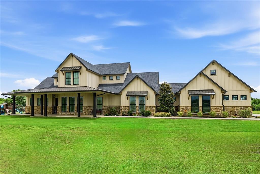 6020 Honeysuckle Road Midlothian, TX 76065 - Photo 35 of 39 Expansive board and batten facade with stone detailing