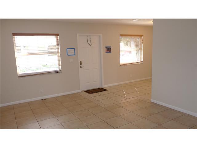 4525 Mathis Street Lake Worth, FL 33461 - Photo 3 of 8 a black and white photo of a living room