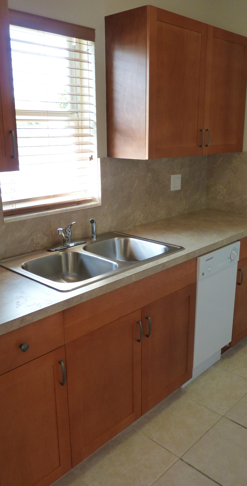 4525 Mathis Street Lake Worth, FL 33461 - Photo 4 of 8 a kitchen with a sink and cabinets