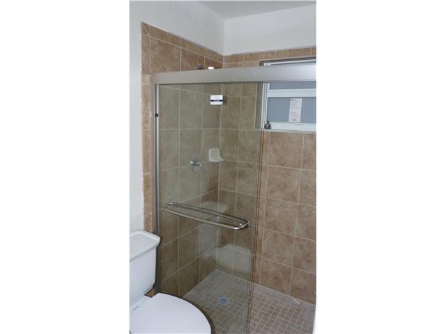 4525 Mathis Street Lake Worth, FL 33461 - Photo 6 of 8 a bathroom with a shower and a toilet