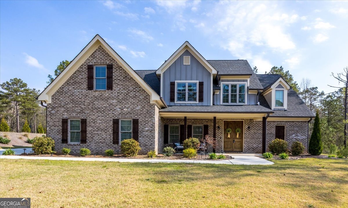 303 Tuxedo Circle Forsyth, GA 31029 - Photo 2 of 45 a front view of a house with a yard