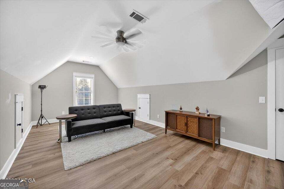 303 Tuxedo Circle Forsyth, GA 31029 - Photo 24 of 45 a view of workspace with wooden floor and ceiling fan
