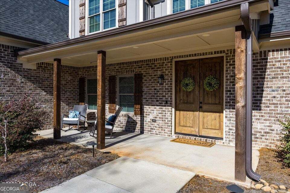 303 Tuxedo Circle Forsyth, GA 31029 - Photo 3 of 45 a view of a building with sitting area