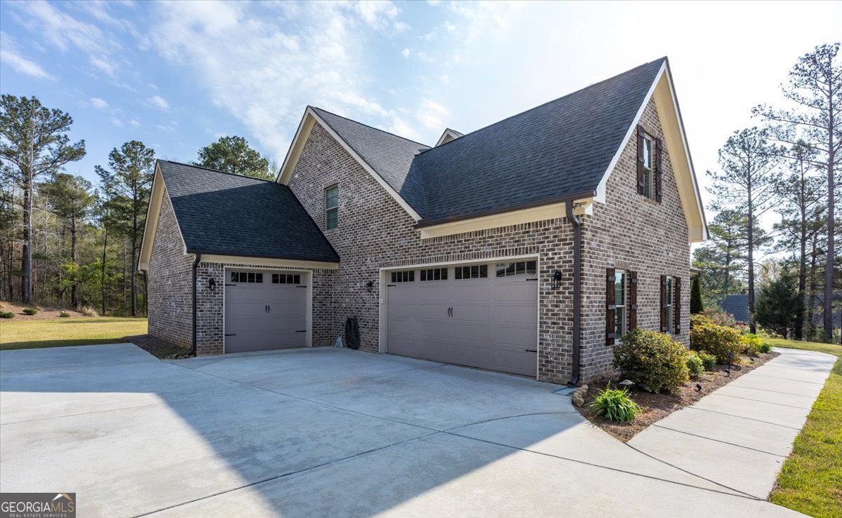 303 Tuxedo Circle Forsyth, GA 31029 - Photo 35 of 45 a view of a house with a garage