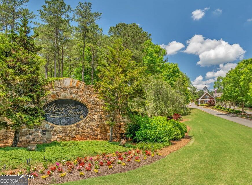 303 Tuxedo Circle Forsyth, GA 31029 - Photo 36 of 45 a backyard of a house with lots of green space and garden view