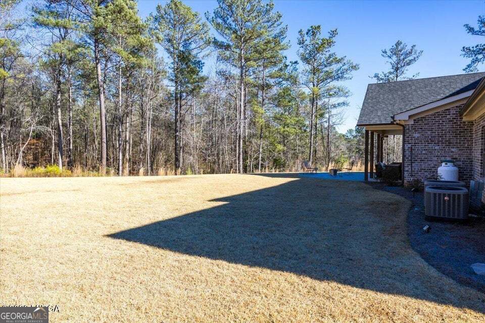 303 Tuxedo Circle Forsyth, GA 31029 - Photo 42 of 45 a view of swimming pool with an outdoor space
