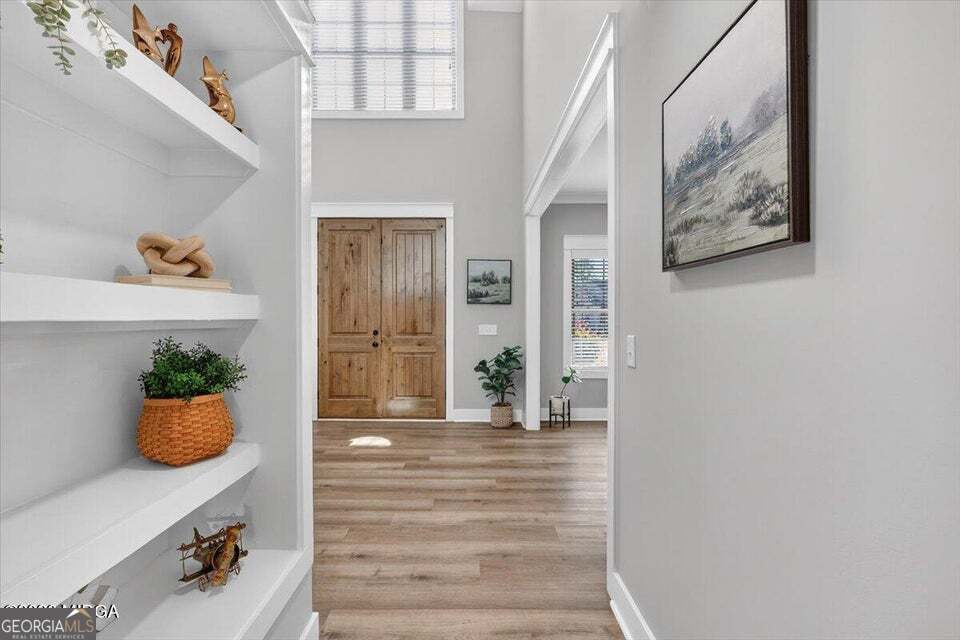 303 Tuxedo Circle Forsyth, GA 31029 - Photo 7 of 45 a view of an entryway with wooden floor