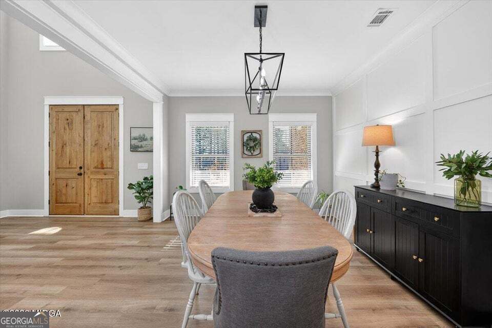 303 Tuxedo Circle Forsyth, GA 31029 - Photo 9 of 45 a dining room with furniture and window