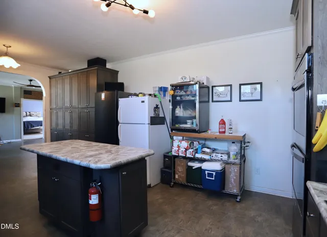a kitchen that has a lot of cabinets in it