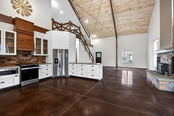 a living room with furniture and large window