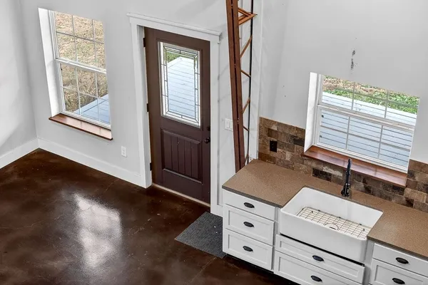 a room with a bed and a window