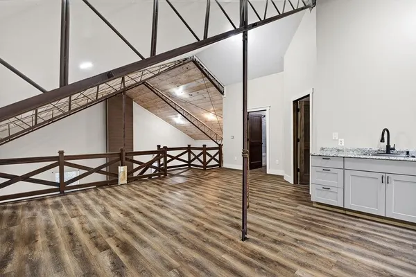 an empty room with windows and closet