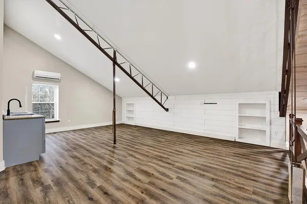 a view of bathroom with sink mirror and bathtub