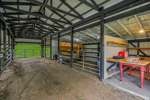 a view of a grassy field with trees