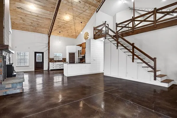 a living room with furniture wooden floor and a flat screen tv