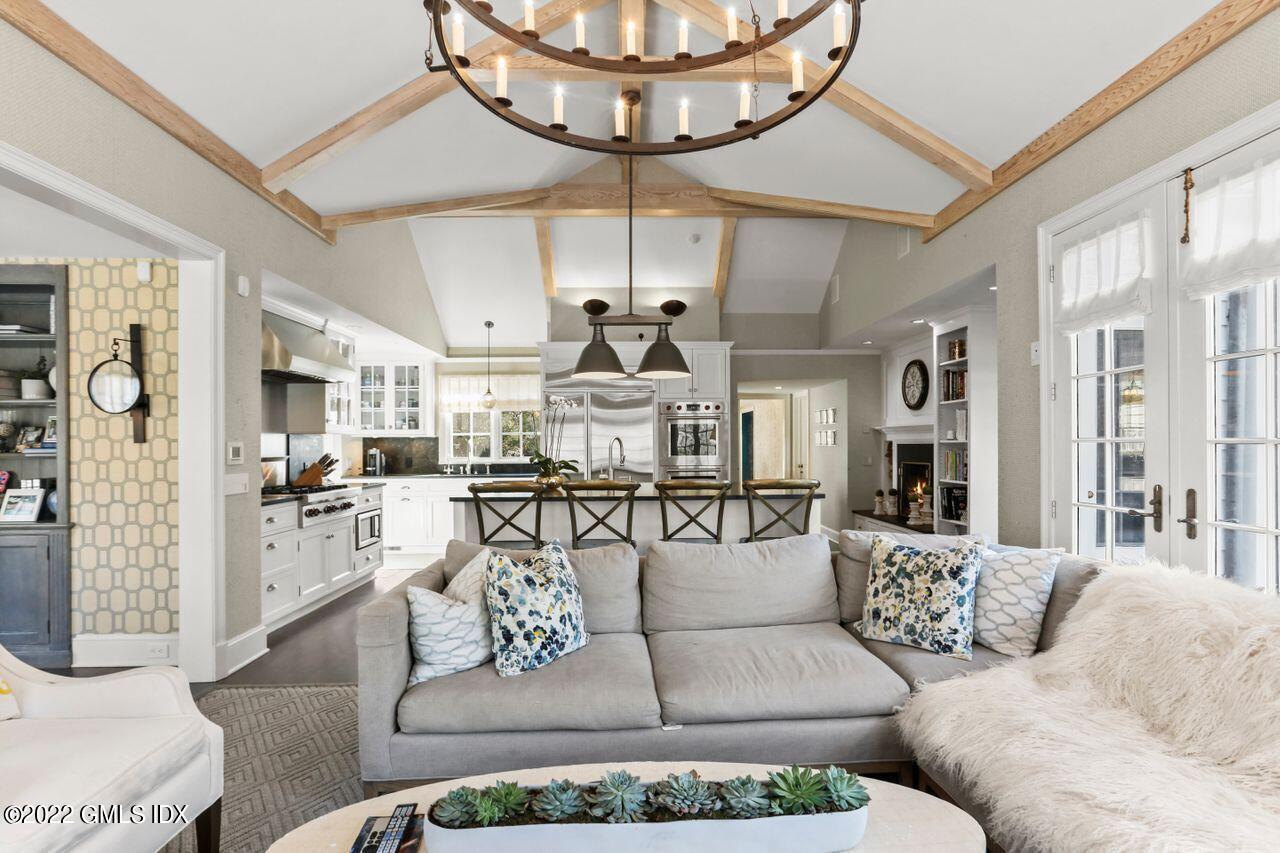 415 Round Hill Road Greenwich, CT 06831 - Photo 12 of 36 a living room with furniture a chandelier and a chandelier