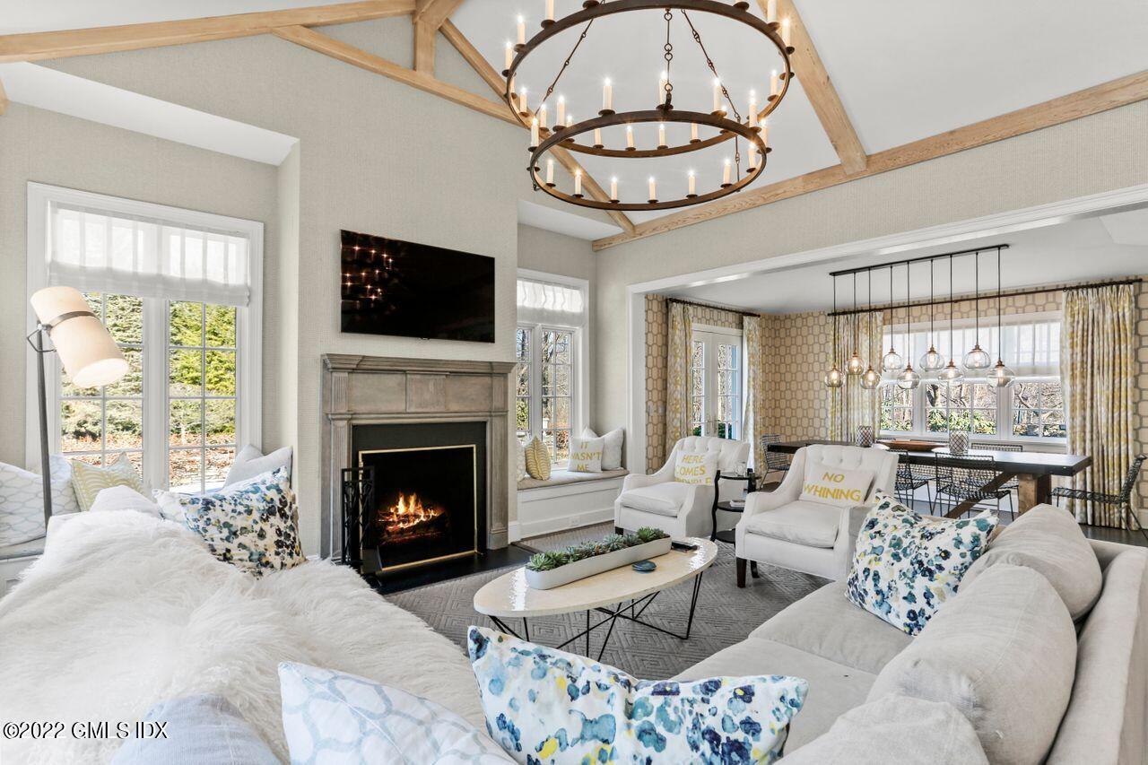 415 Round Hill Road Greenwich, CT 06831 - Photo 13 of 36 a living room with furniture a flat screen tv and a fireplace