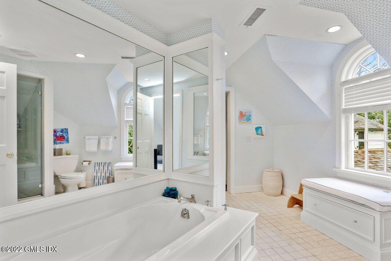 415 Round Hill Road Greenwich, CT 06831 - Photo 25 of 36 a bathroom with a bathtub and a sink