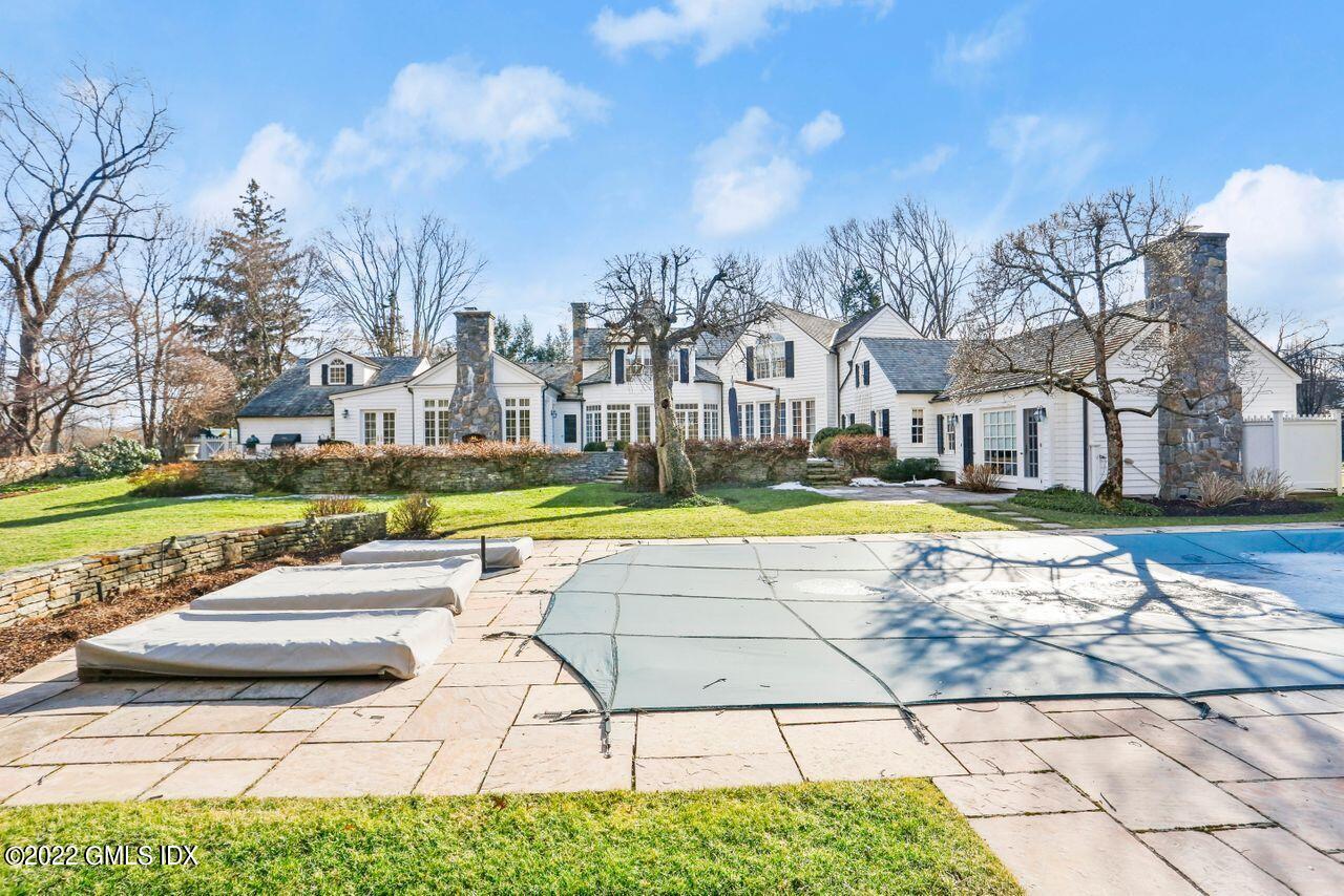415 Round Hill Road Greenwich, CT 06831 - Photo 30 of 36 a view of a swimming pool with an outdoor space and seating area