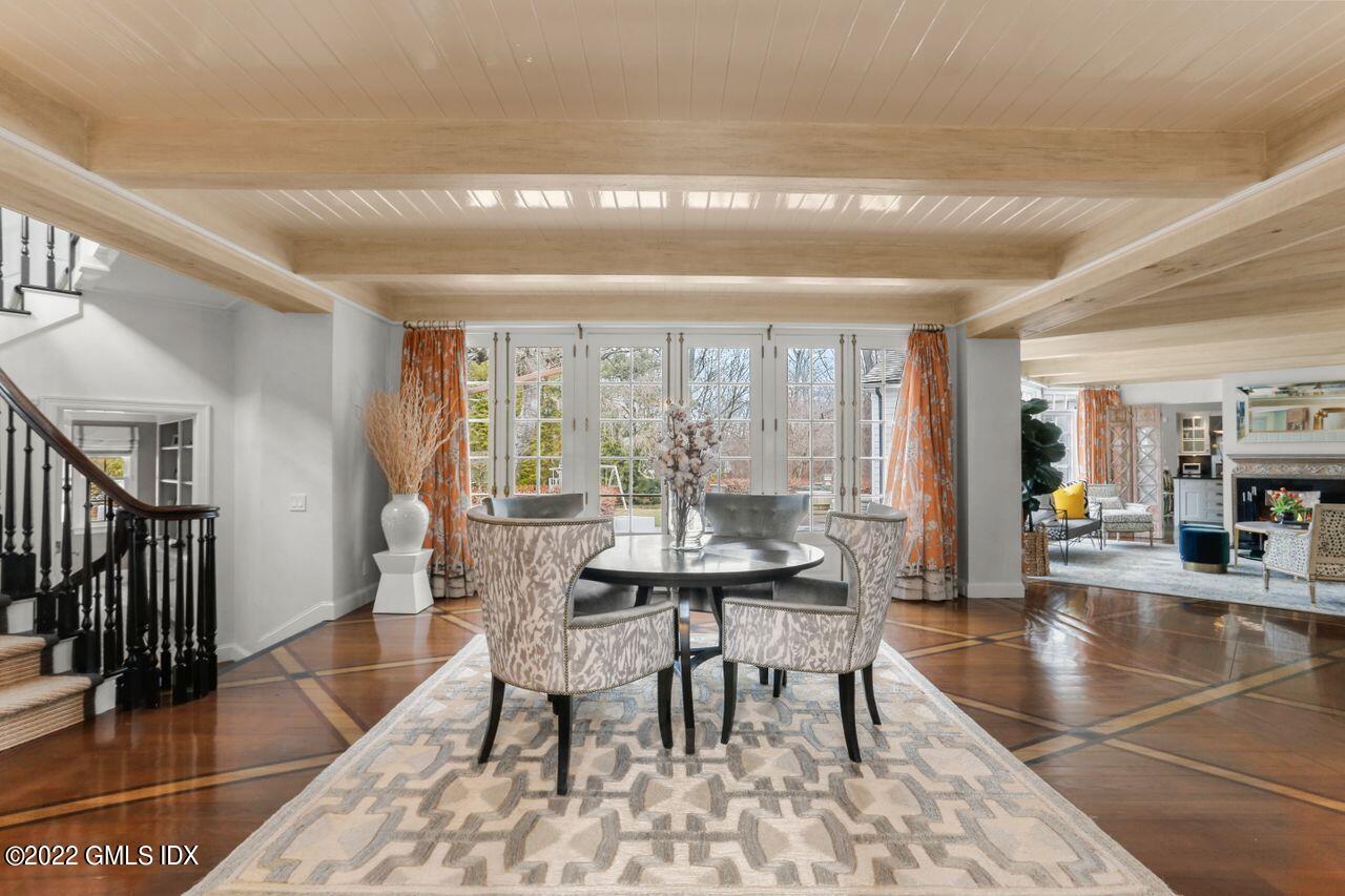 415 Round Hill Road Greenwich, CT 06831 - Photo 5 of 36 a dining room with furniture and wooden floor