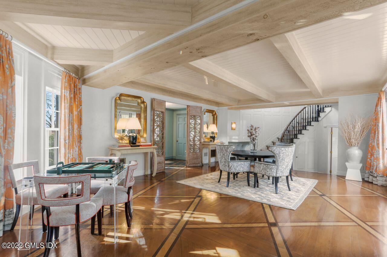 415 Round Hill Road Greenwich, CT 06831 - Photo 6 of 36 a dining room with wooden floor and furniture