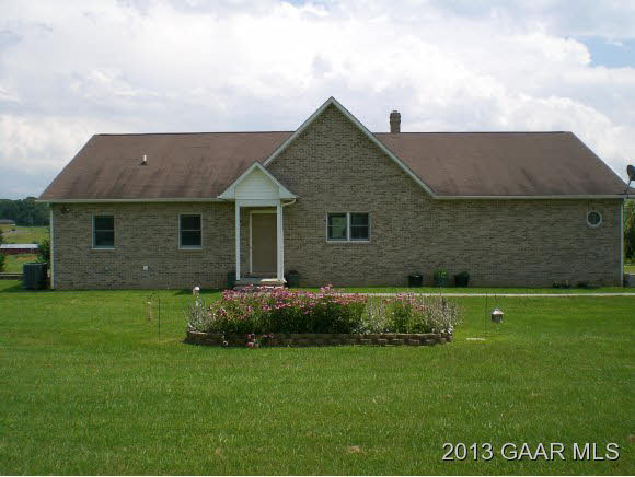 1115 Middlebrook Road Staunton, VA 24401 - Photo 3 of 12 a front view of a house with a garden
