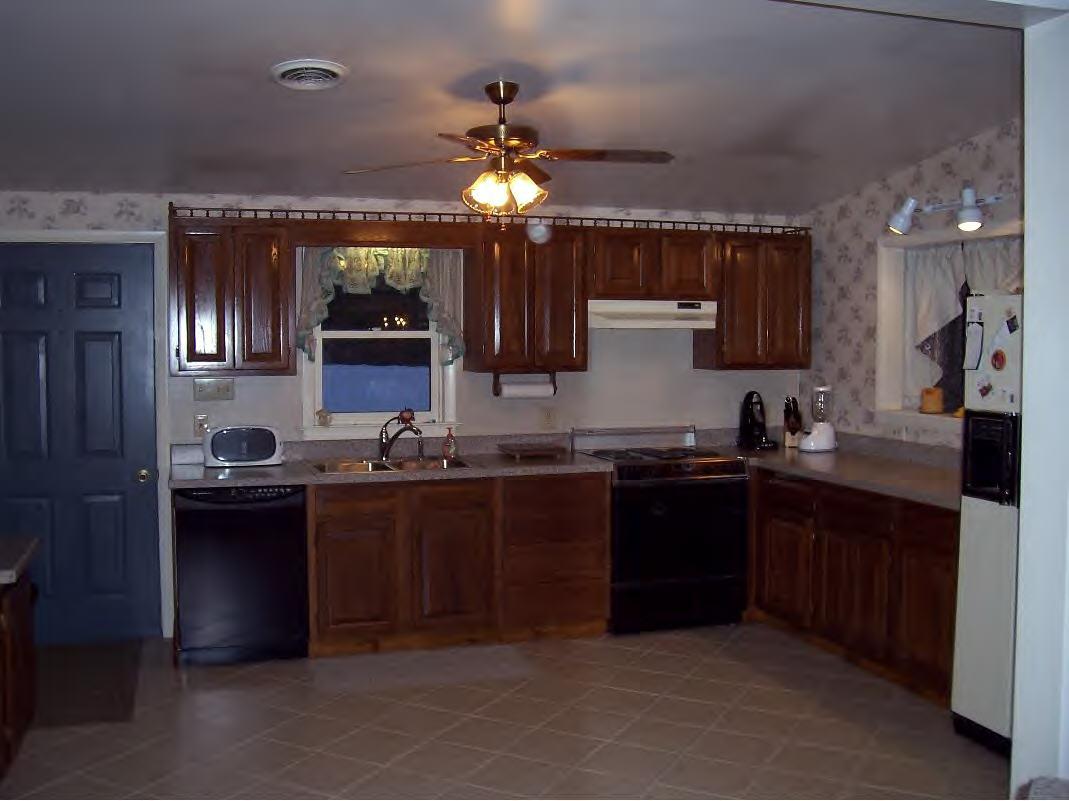 158 Bunce Road South Sheffield, MA 01222 - Photo 2 of 6 a kitchen with a sink and a stove