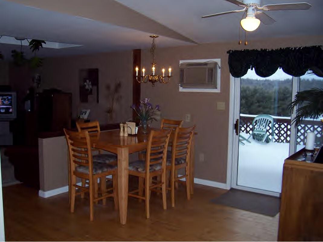 158 Bunce Road South Sheffield, MA 01222 - Photo 3 of 6 a dining room with furniture and chandelier kitchen view