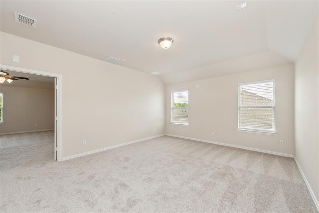 12571 Valley Spring Drive Frisco, TX 75035 - Photo 31 of 39 an empty room with windows