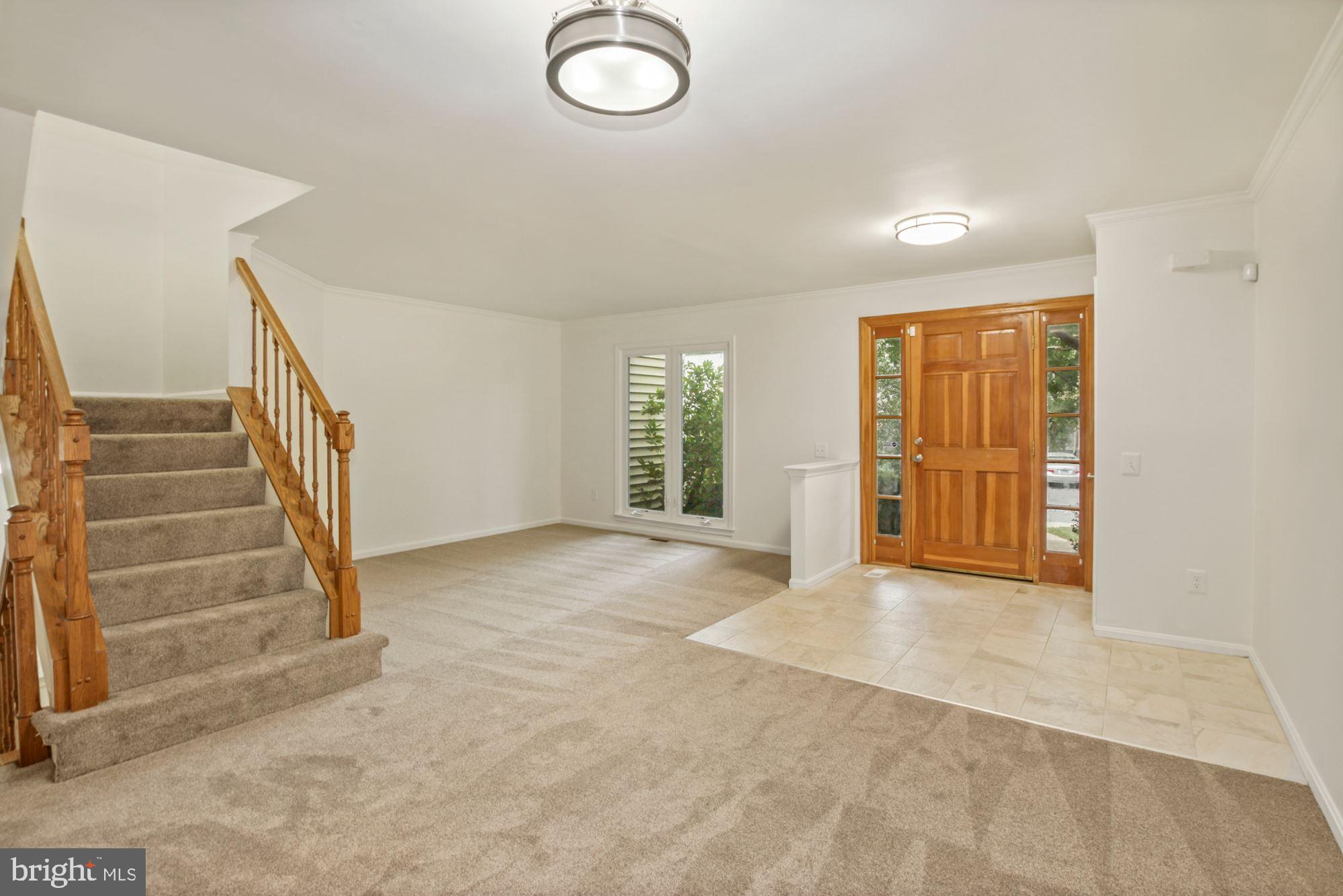 214 Finale Terrace Silver Spring, MD 20901 - Photo 5 of 32 LIVING ROOM TO DOOR