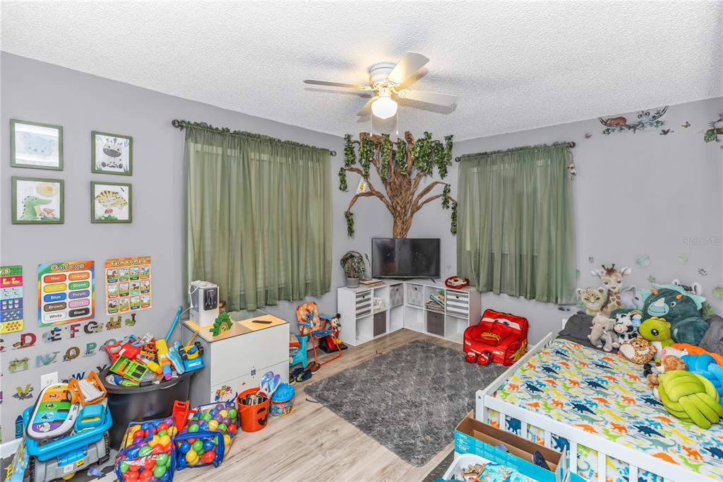1186 Azora Drive Deltona, FL 32725 - Photo 12 of 24 a living room filled with furniture and a dining table
