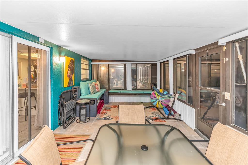 1186 Azora Drive Deltona, FL 32725 - Photo 17 of 24 a living room with furniture and floor to ceiling windows