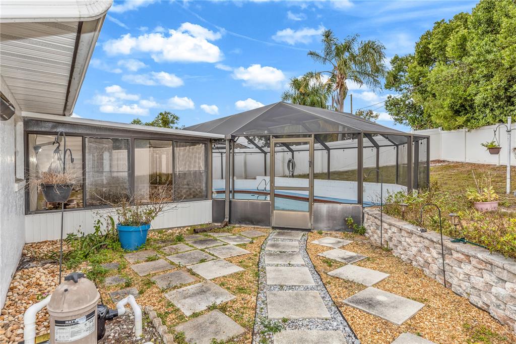 1186 Azora Drive Deltona, FL 32725 - Photo 20 of 24 a view of a backyard with a patio and fire pit