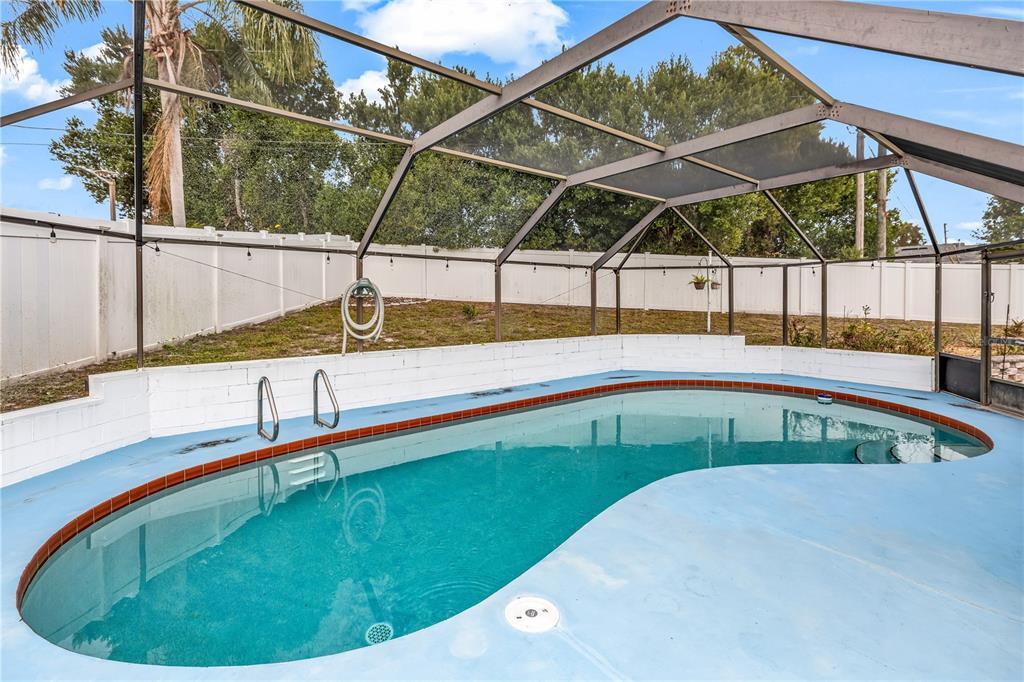 1186 Azora Drive Deltona, FL 32725 - Photo 2 of 24 a view of a backyard with a swimming pool