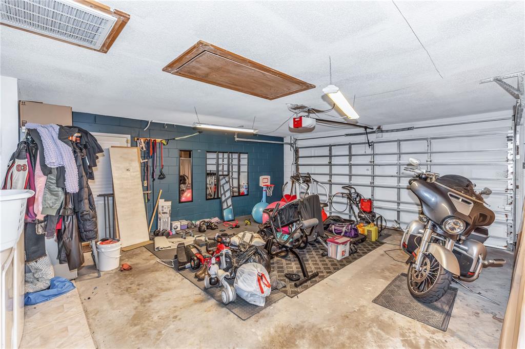 1186 Azora Drive Deltona, FL 32725 - Photo 24 of 24 a view of a garage with a bike and car