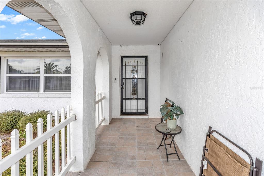 1186 Azora Drive Deltona, FL 32725 - Photo 3 of 24 a view of a house with wooden floor and chair