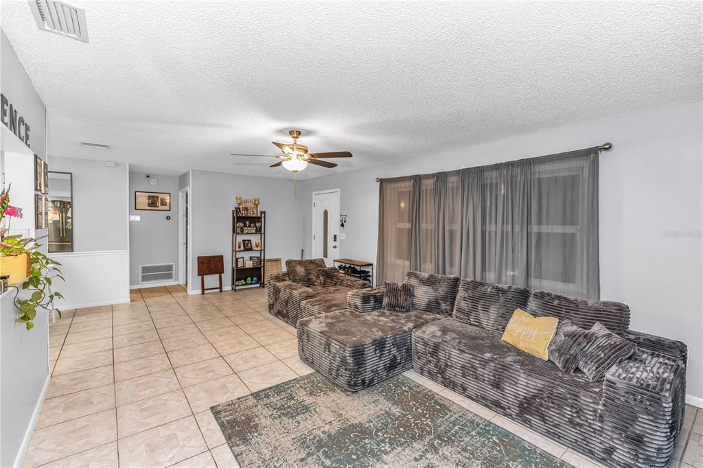 1186 Azora Drive Deltona, FL 32725 - Photo 7 of 24 a living room with furniture