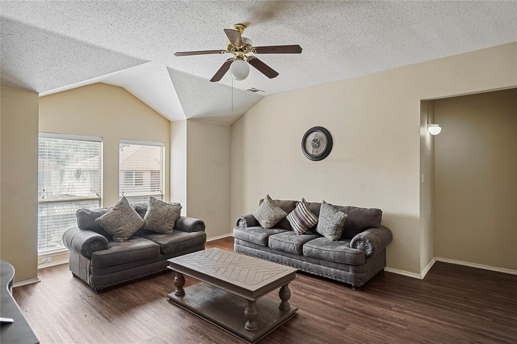 1934 Pin Oak Lane Lancaster, TX 75146 - Photo 16 of 27 a living room with furniture and a window