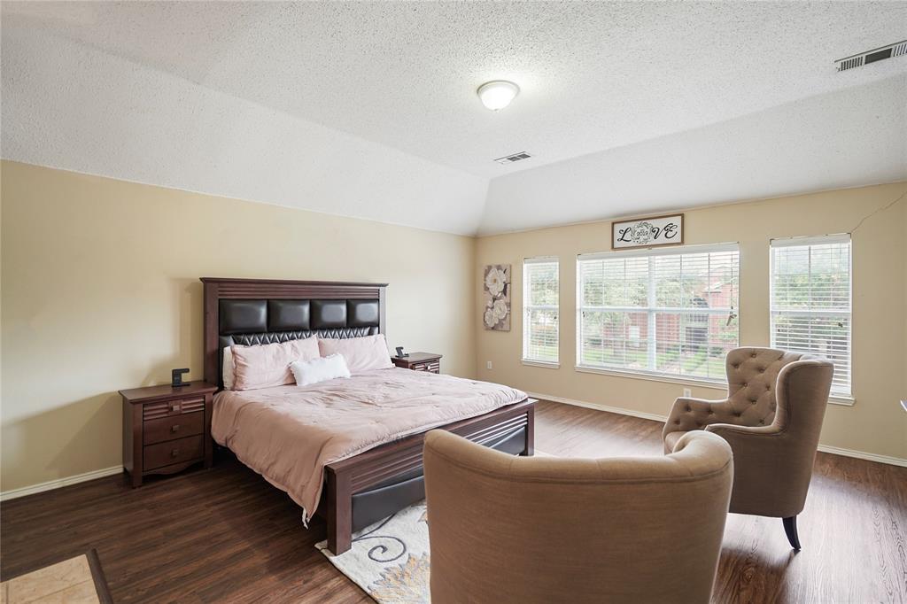 1934 Pin Oak Lane Lancaster, TX 75146 - Photo 18 of 27 a bedroom with a bed and a large window